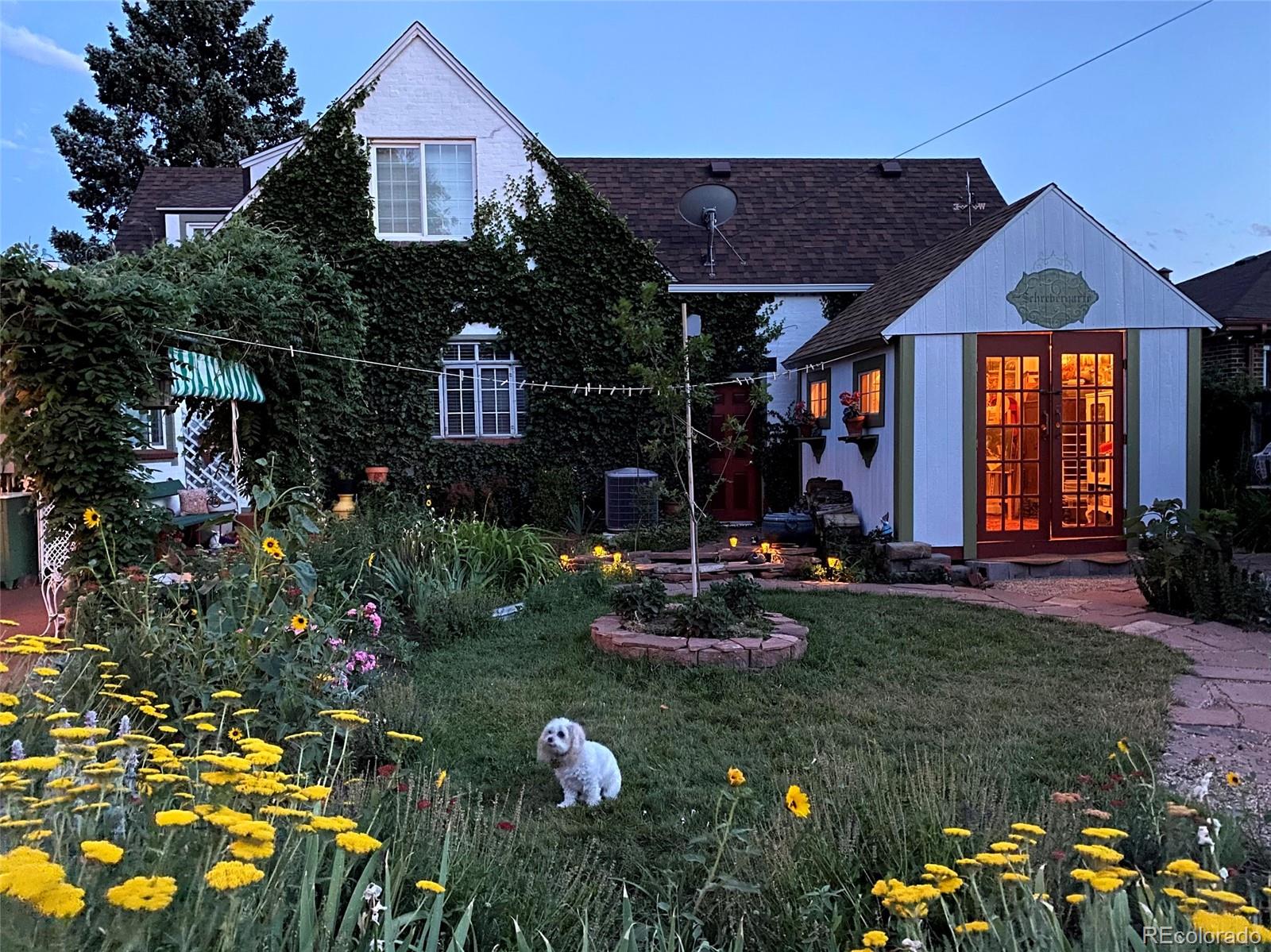 3917 Haddon Road Denver, CO 80205 - Photo 30 of 40 a front view of a house with a yard