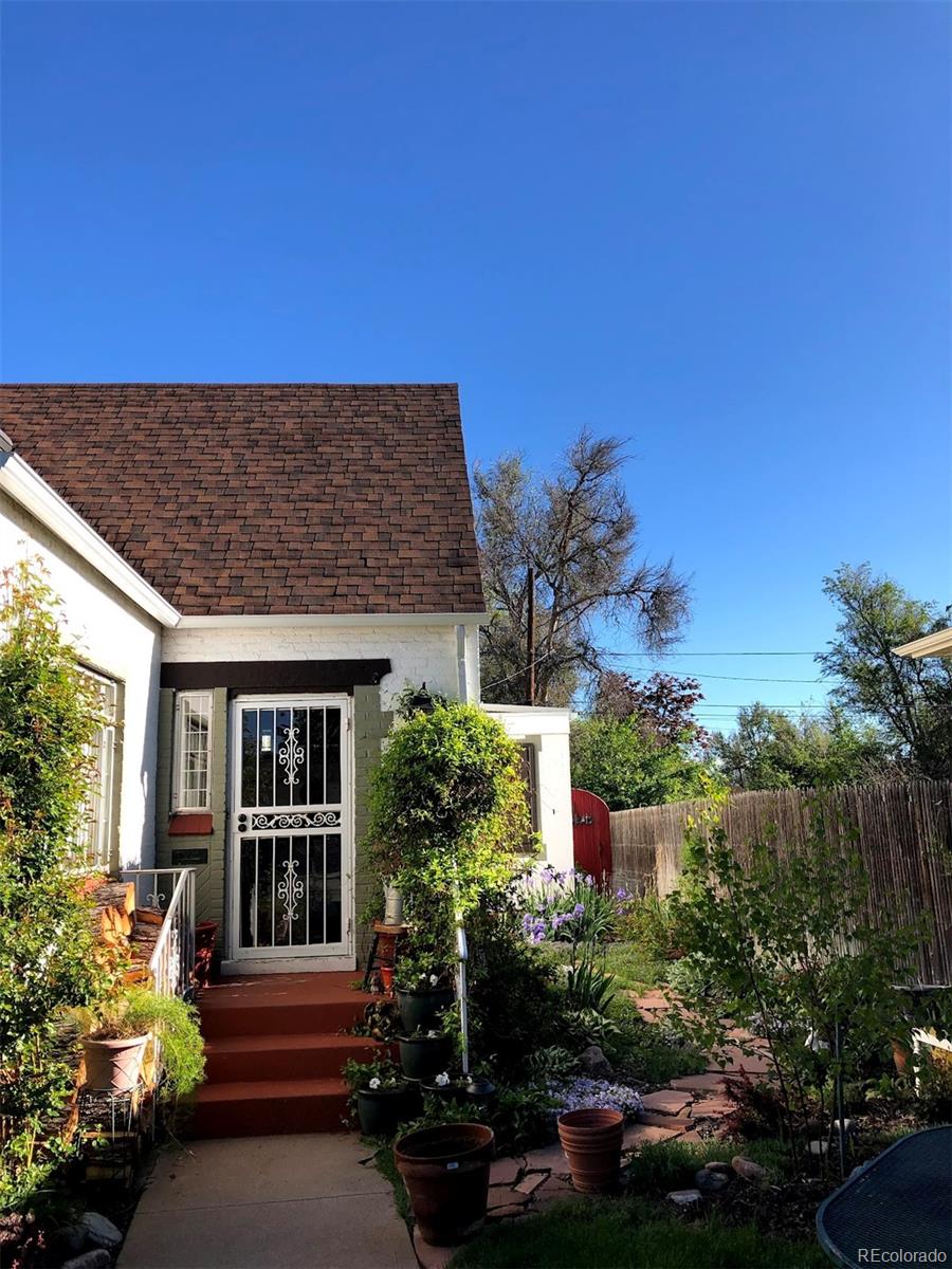 3917 Haddon Road Denver, CO 80205 - Photo 31 of 40 a front view of a house with a yard