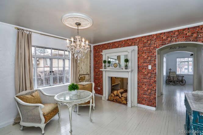 3917 Haddon Road Denver, CO 80205 - Photo 10 of 40 a living room with furniture and a fireplace