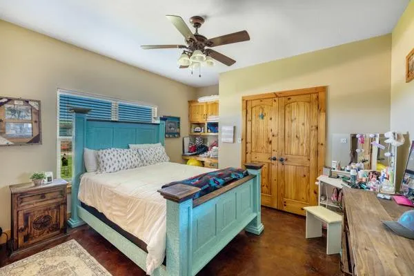 a bedroom with a bed and a window