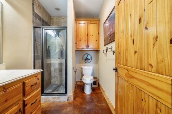 6808 Cedar Hill Road Brenham, TX 77833 - Photo 12 of 40 a bathroom with a granite countertop sink toilet and shower