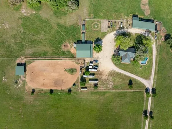an aerial view of a house with a swimming pool
