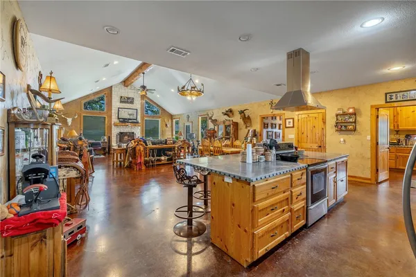 a view of a kitchen with dining table and chairs