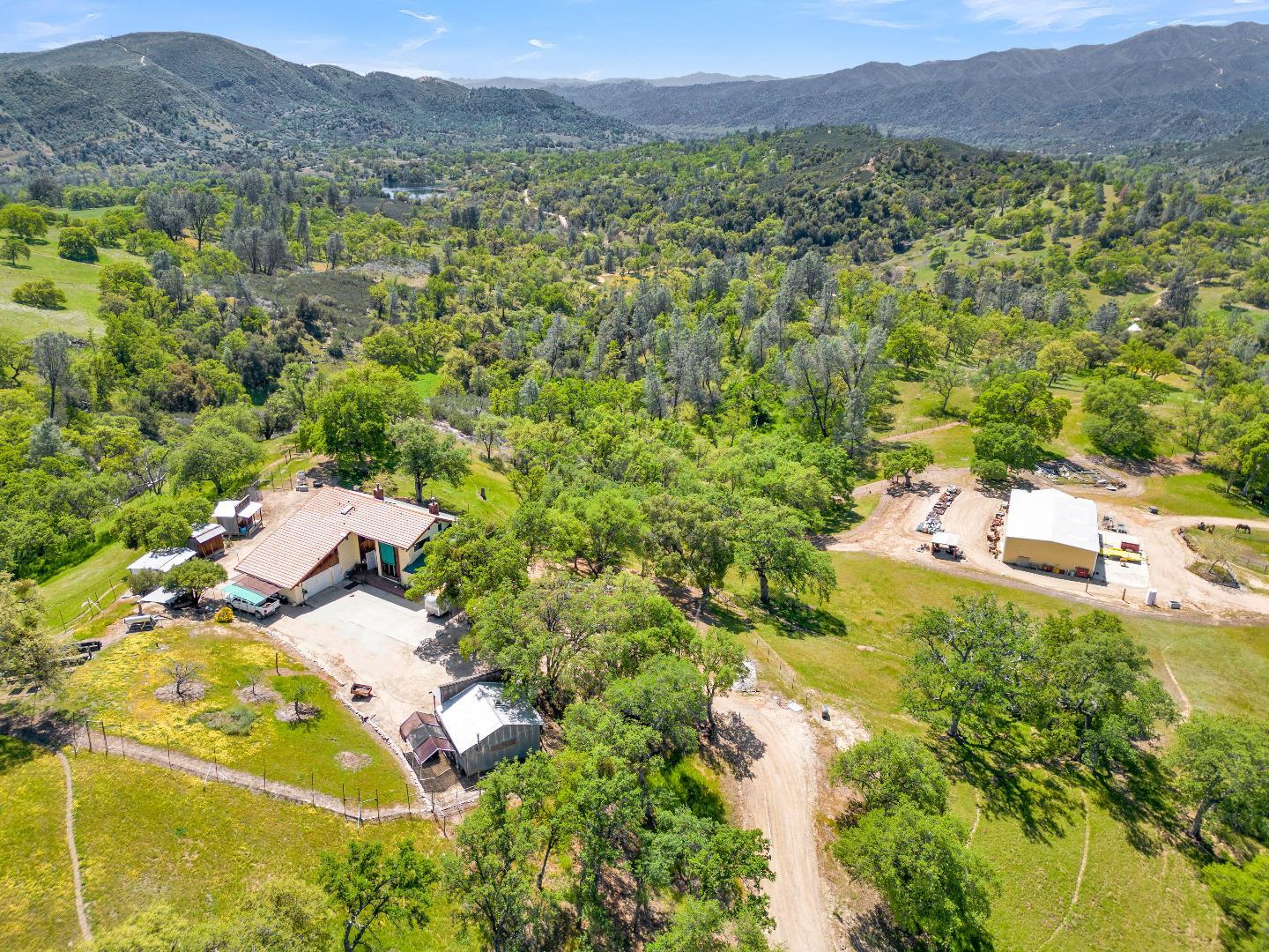 38483 Milpitas Road Greenfield, CA 93927 - Photo 1 of 55 a view of a lush green field with mountains in the background