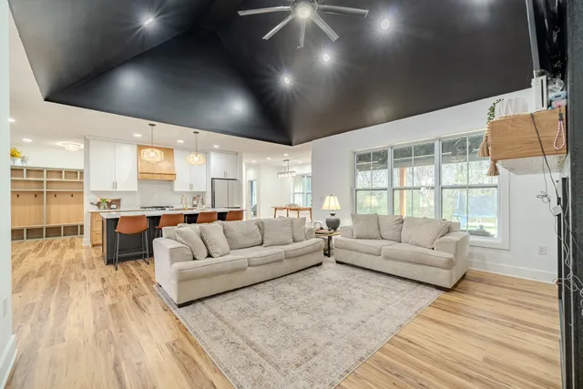 a kitchen with stainless steel appliances granite countertop a sink and cabinets
