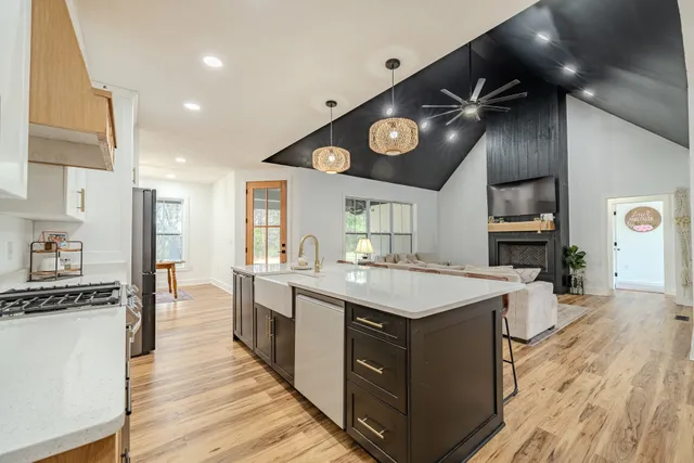 a view of kitchen cabinets with stainless steel appliances wooden floor and cabinet