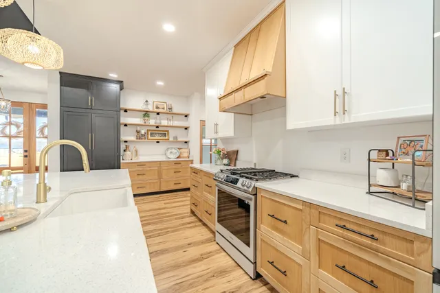 a view of a room with wooden floor and windows