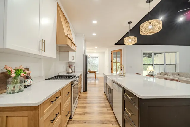 a view of a livingroom with furniture window and wooden floor