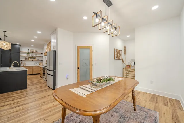 a spacious bathroom with a double vanity sink and mirror