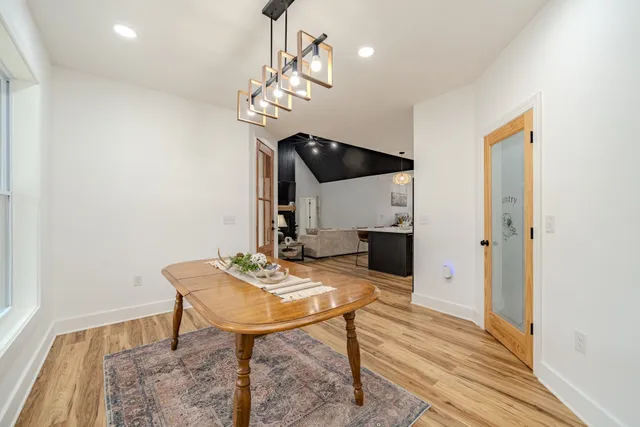 a white toilet sitting next to a white wall