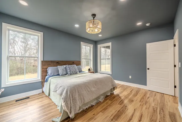 a spacious bathroom with a double vanity sink and mirror