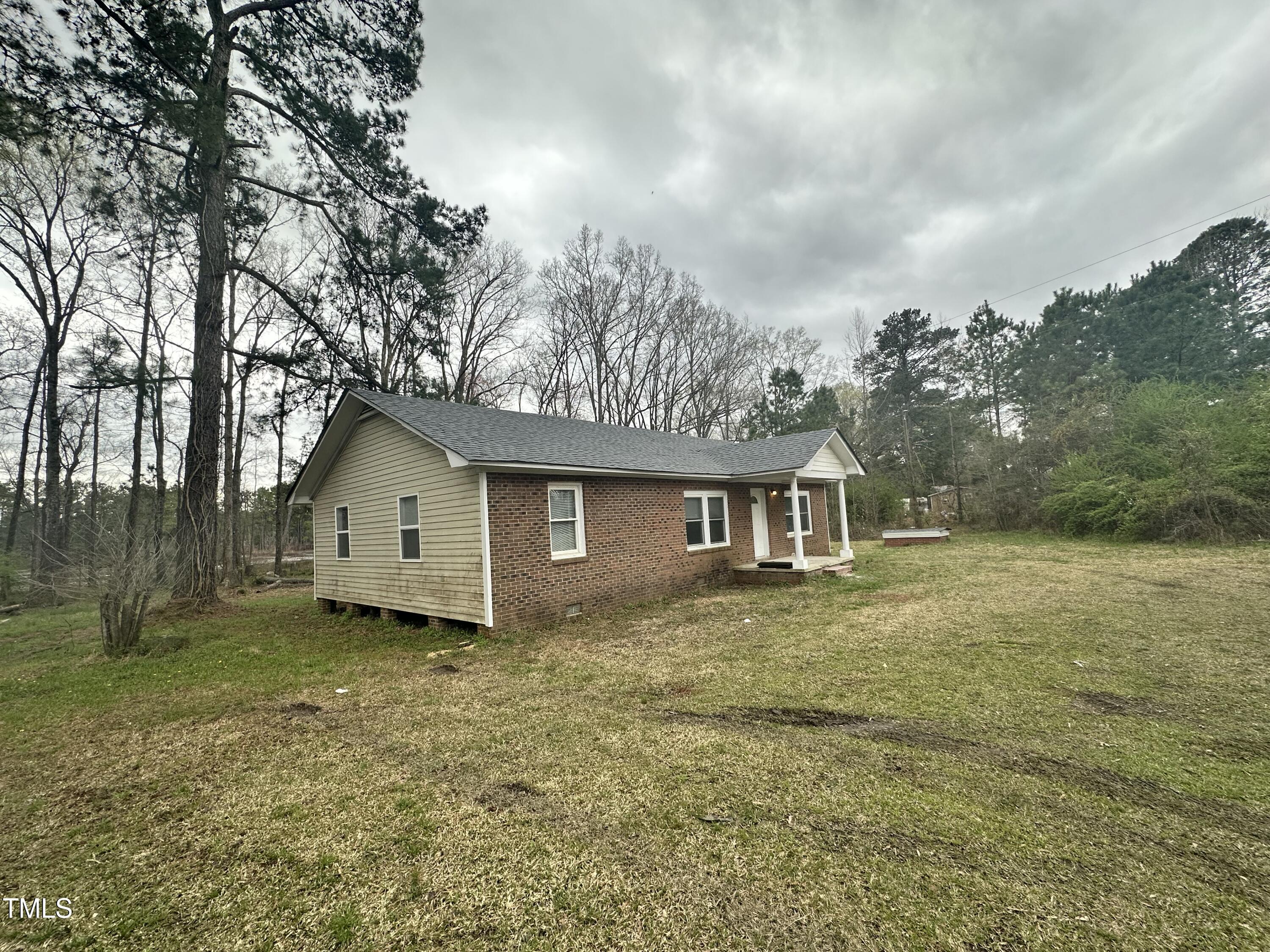 4989 Highway 217 Erwin, NC 28339 - Photo 2 of 14 a view of a house with a yard