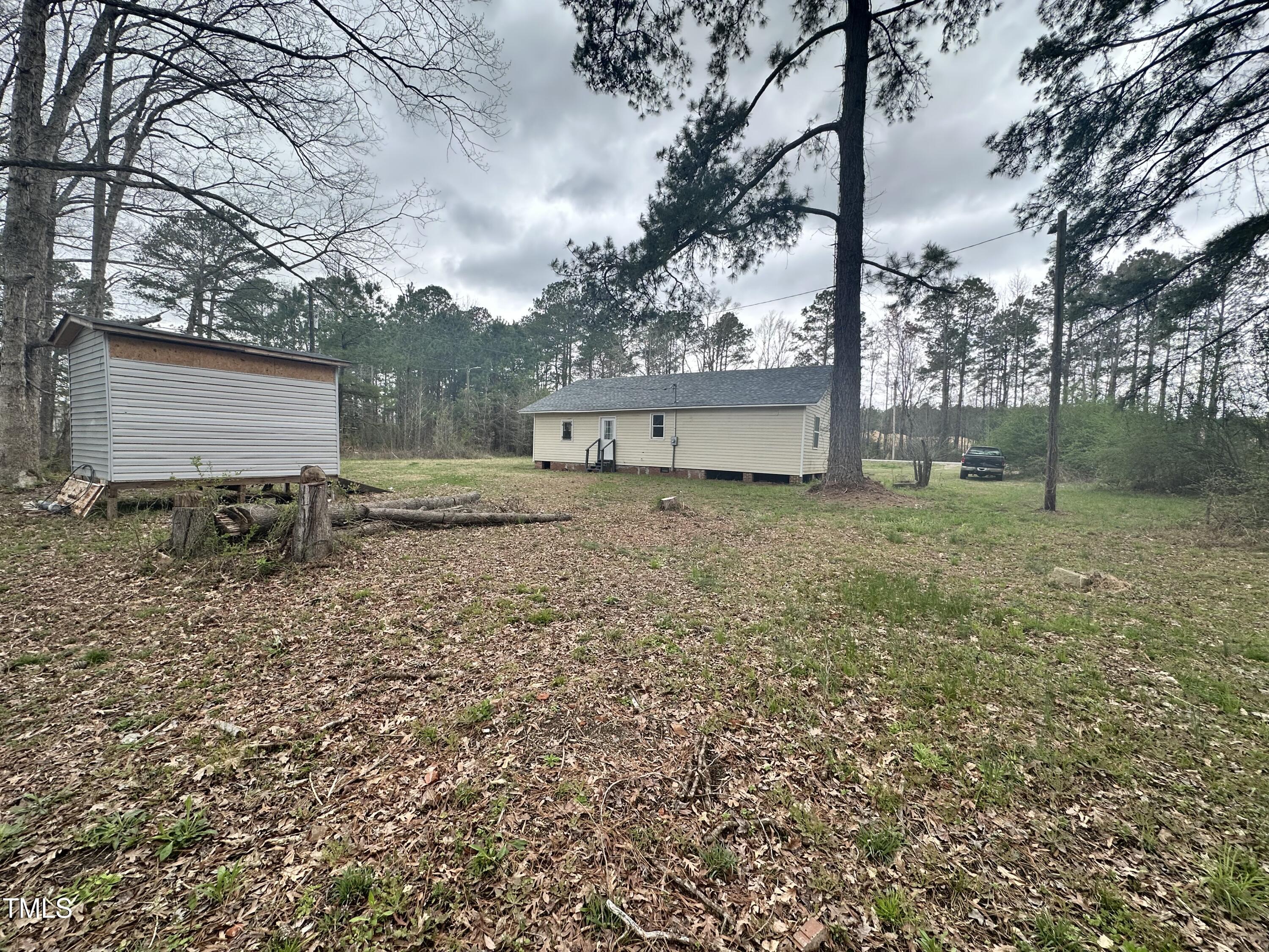 4989 Highway 217 Erwin, NC 28339 - Photo 4 of 14 a view of backyard of house with green space