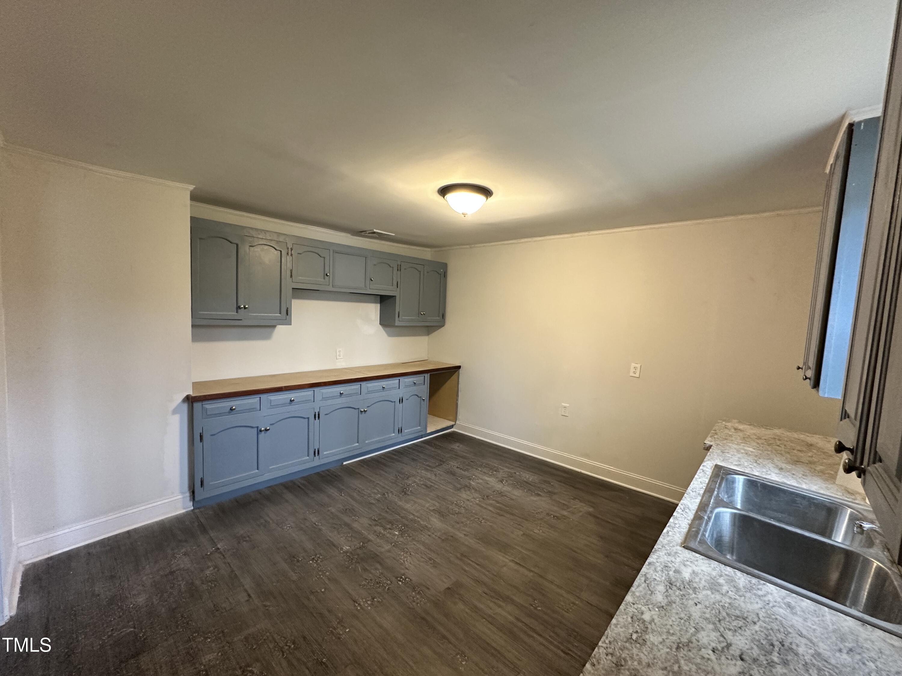 4989 Highway 217 Erwin, NC 28339 - Photo 6 of 14 a room with a bed and a dresser in it