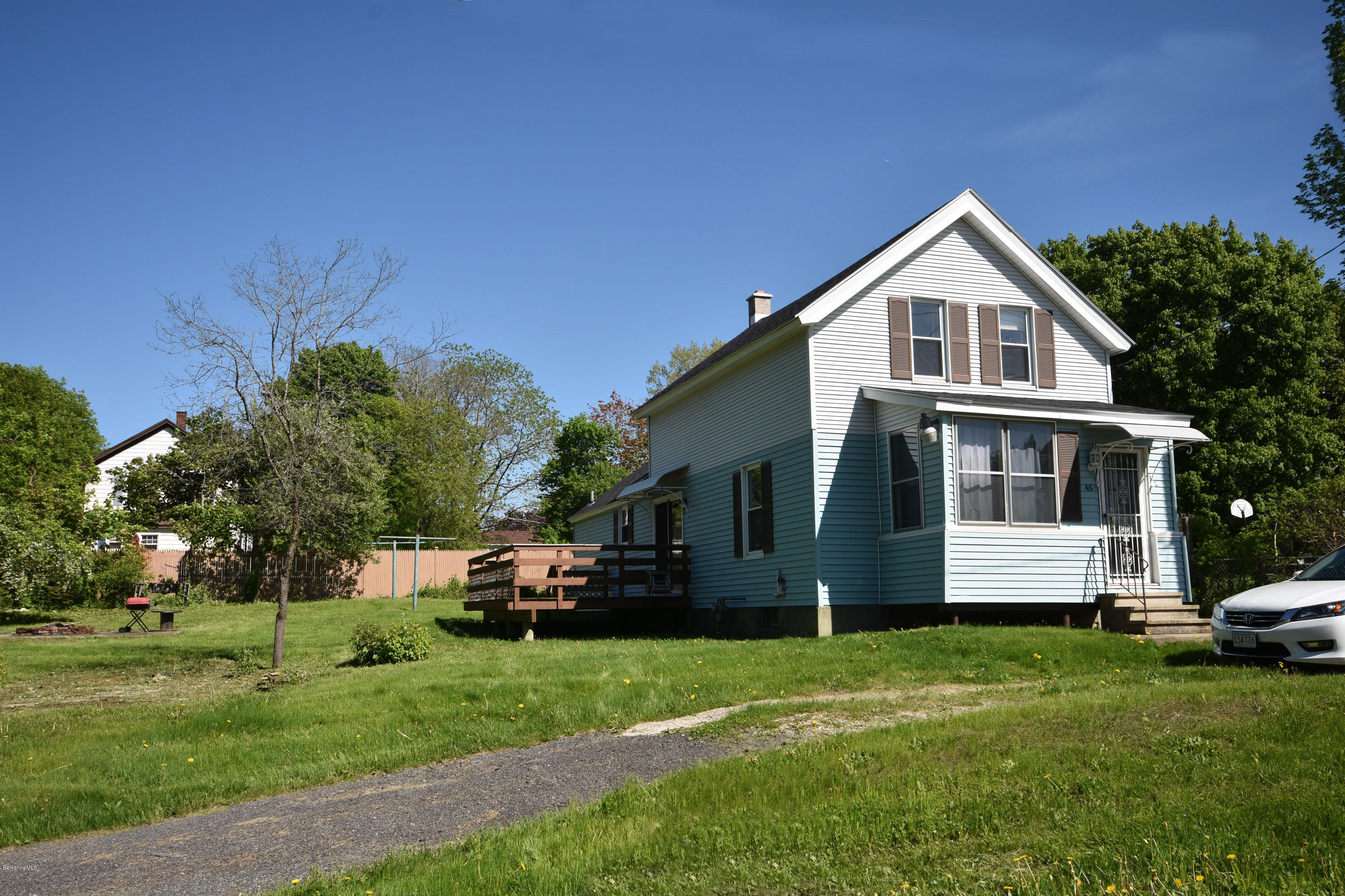 46 Berkley Street Pittsfield, MA 01201 - Photo 1 of 42 a front view of a house with a garden