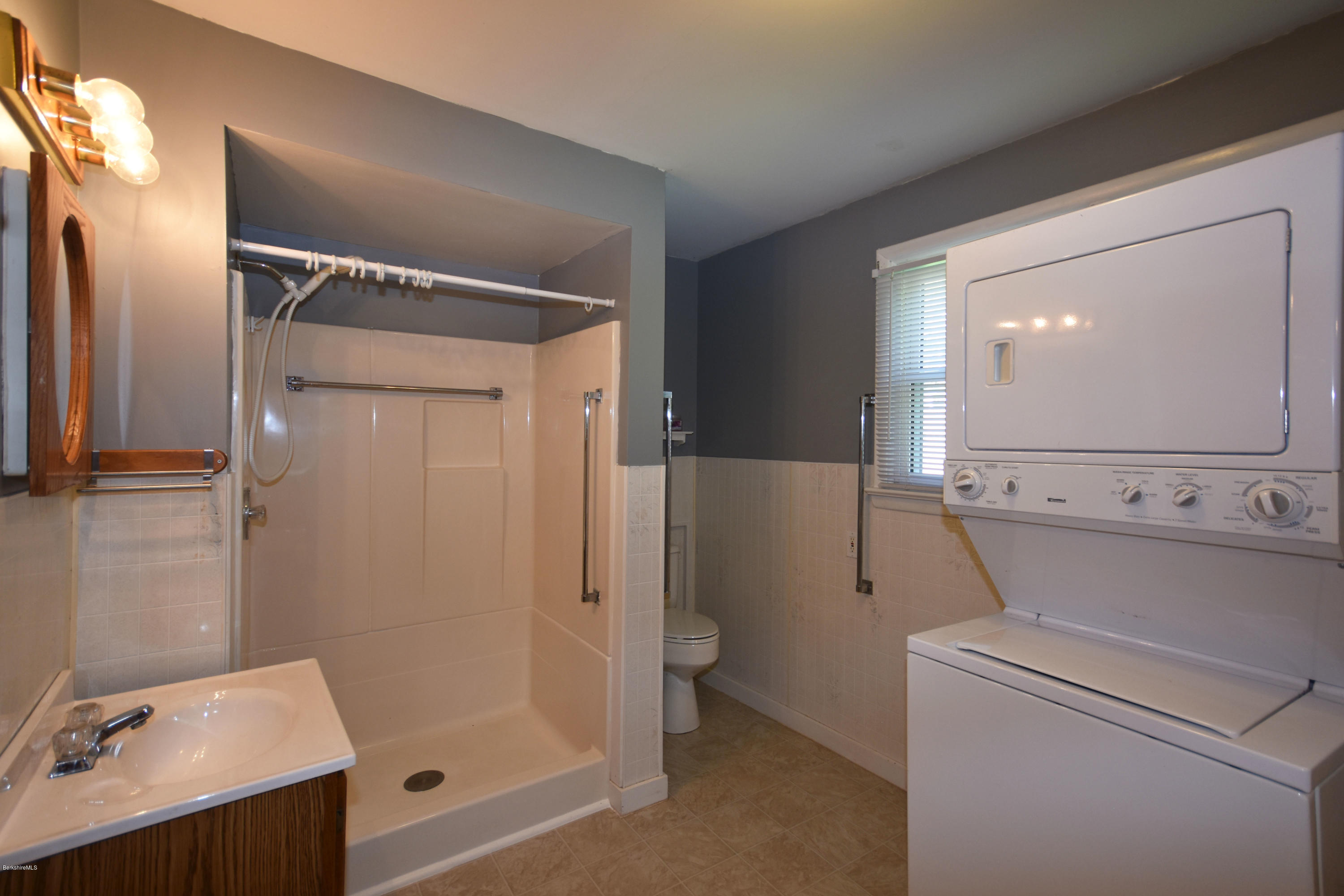 46 Berkley Street Pittsfield, MA 01201 - Photo 18 of 42 a bathroom with a shower sink and mirror