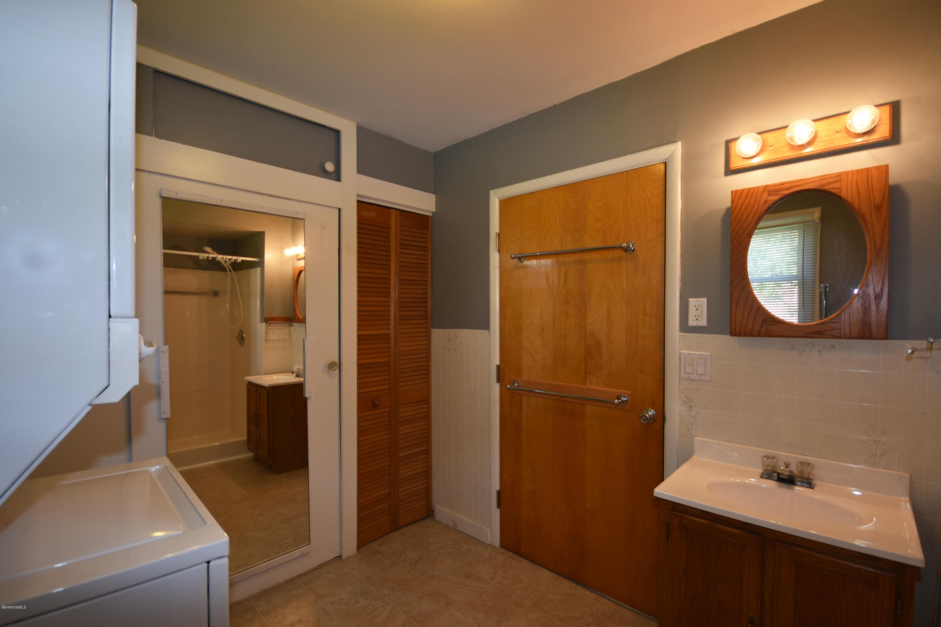 46 Berkley Street Pittsfield, MA 01201 - Photo 20 of 42 a bathroom with a sink and a mirror