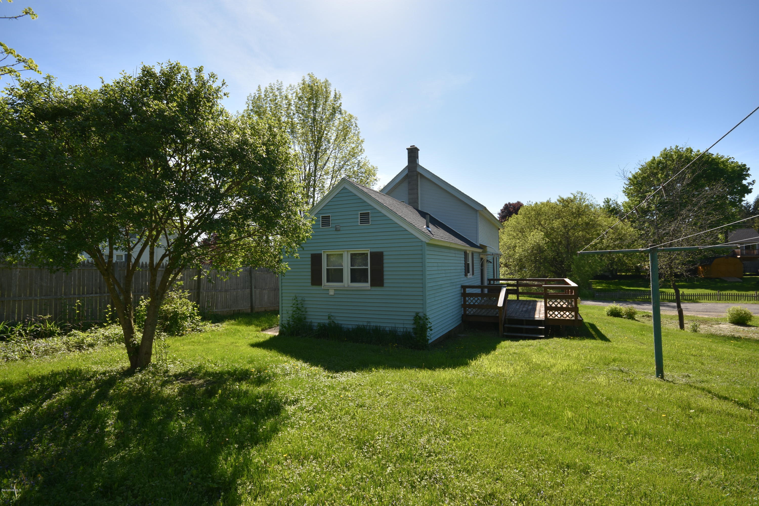 46 Berkley Street Pittsfield, MA 01201 - Photo 35 of 42 a view of a backyard with a garden and trees