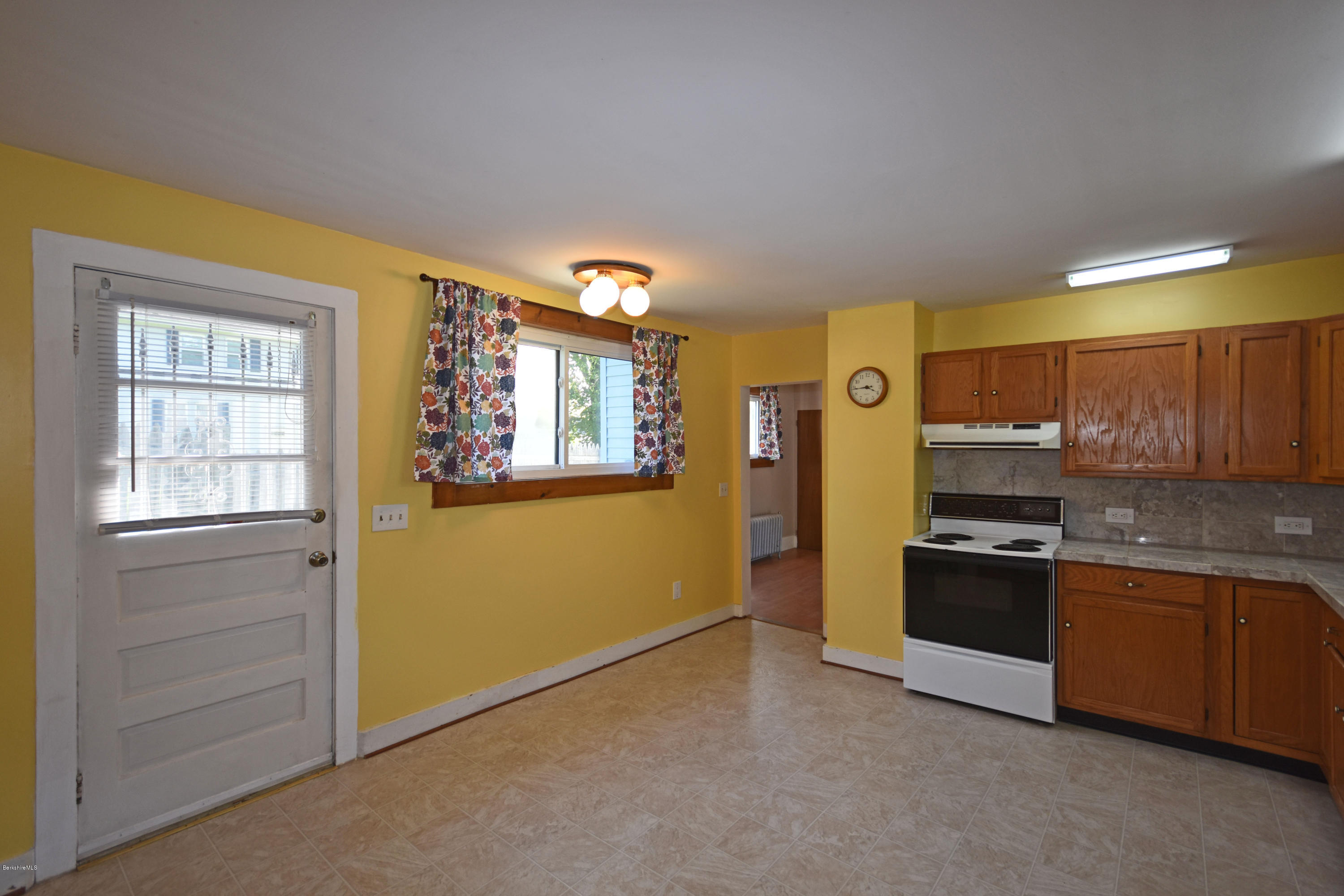46 Berkley Street Pittsfield, MA 01201 - Photo 8 of 42 a kitchen with stainless steel appliances granite countertop a refrigerator and a stove top oven