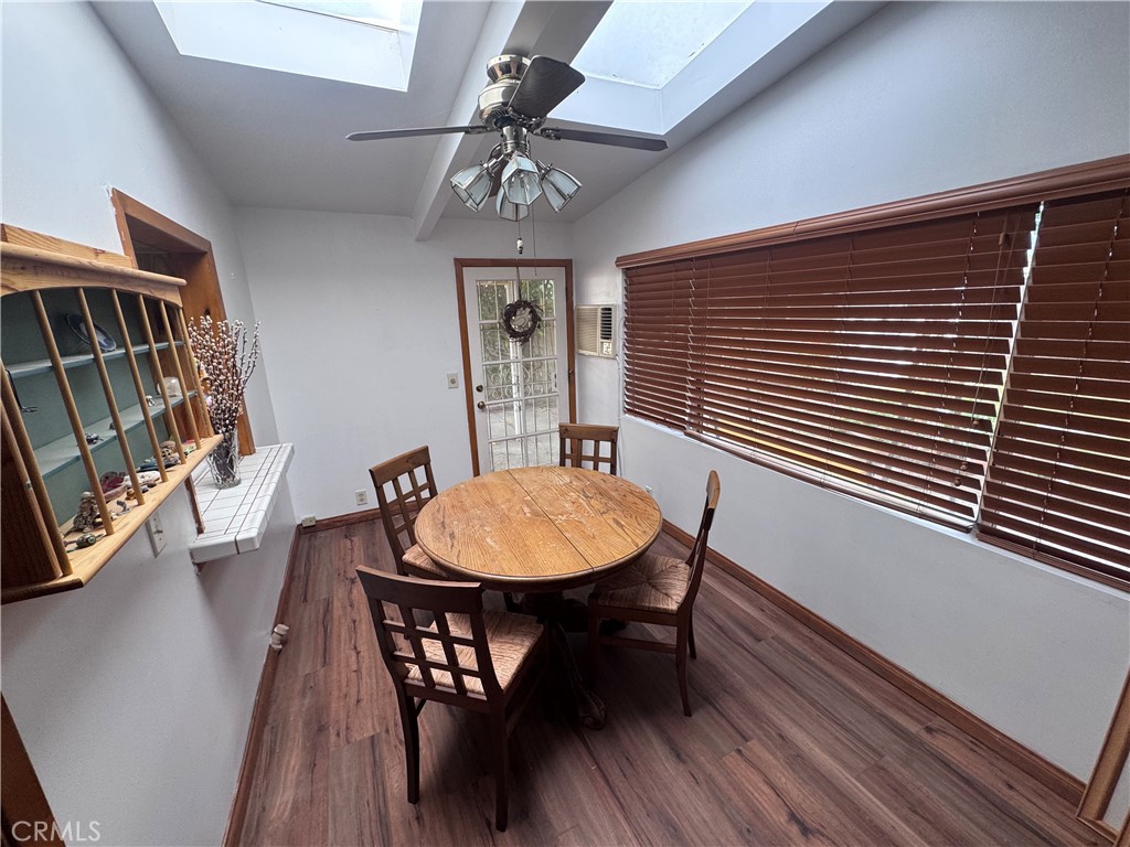 19509 Stagg Street Reseda, CA 91335 - Photo 4 of 9 a view of a dining room with furniture window and wooden floor