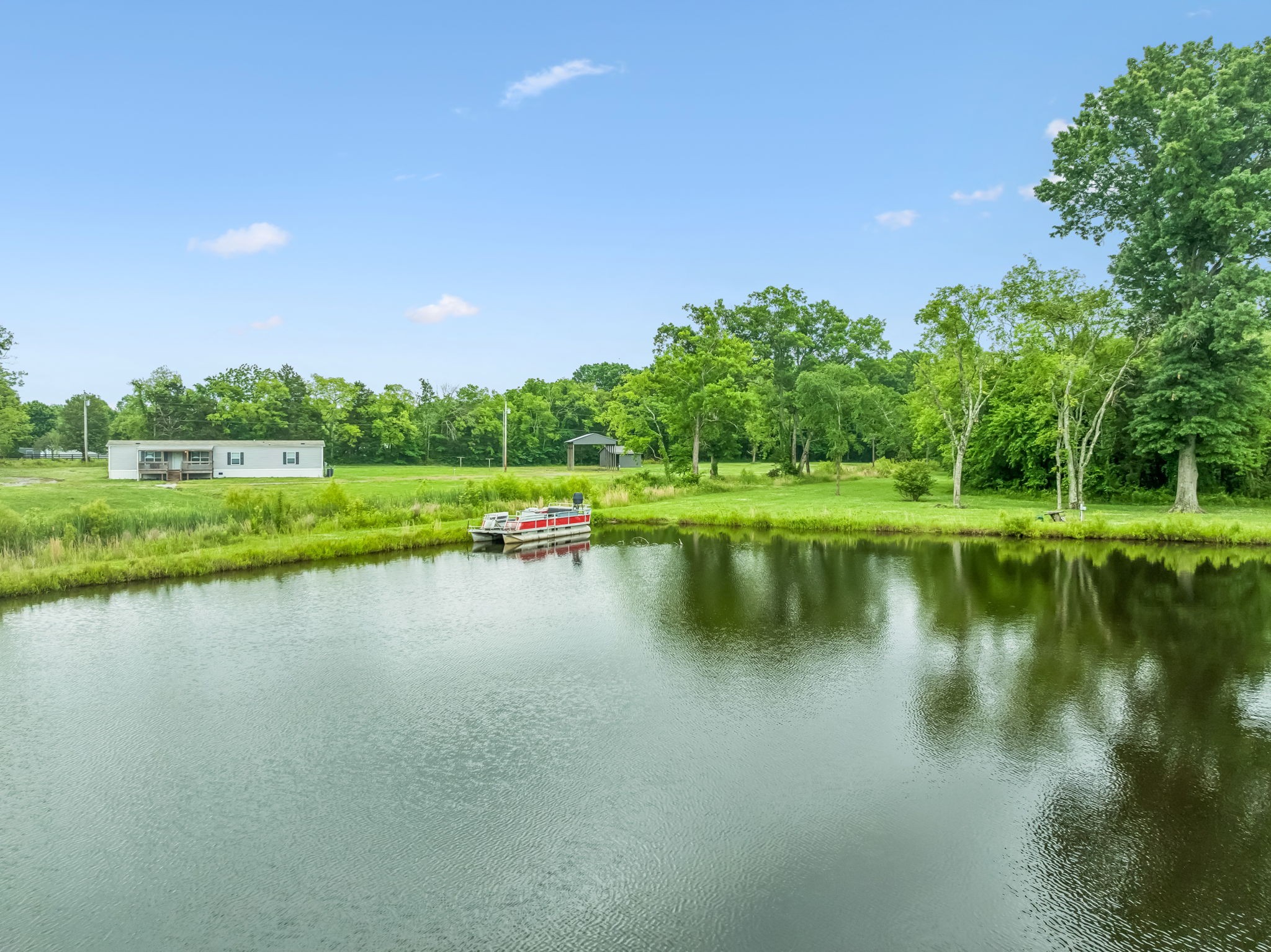 280 Kingdom Road Unionville, TN 37180 - Photo 41 of 65 a view of a lake with houses in the background