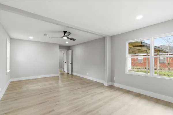 a view of an empty room with a window