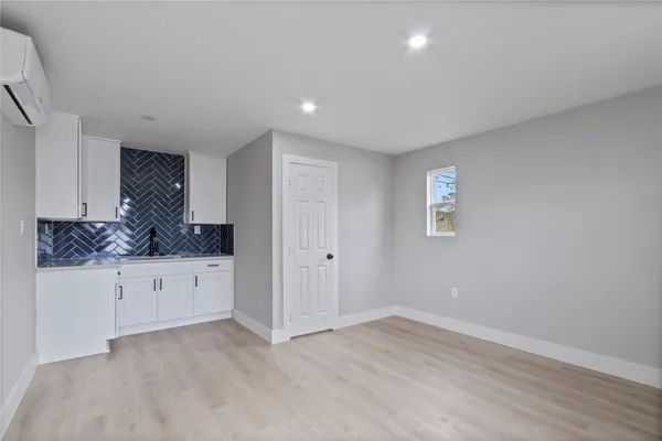 a view of cabinets and window