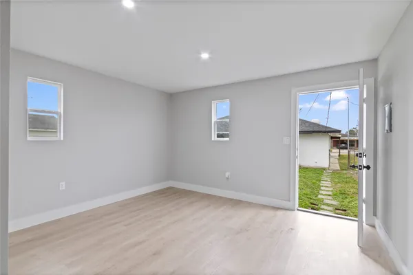 a view of an empty room with a fireplace