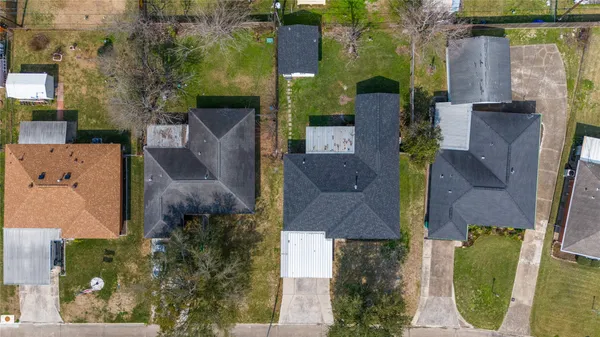 an aerial view of a house with outdoor space