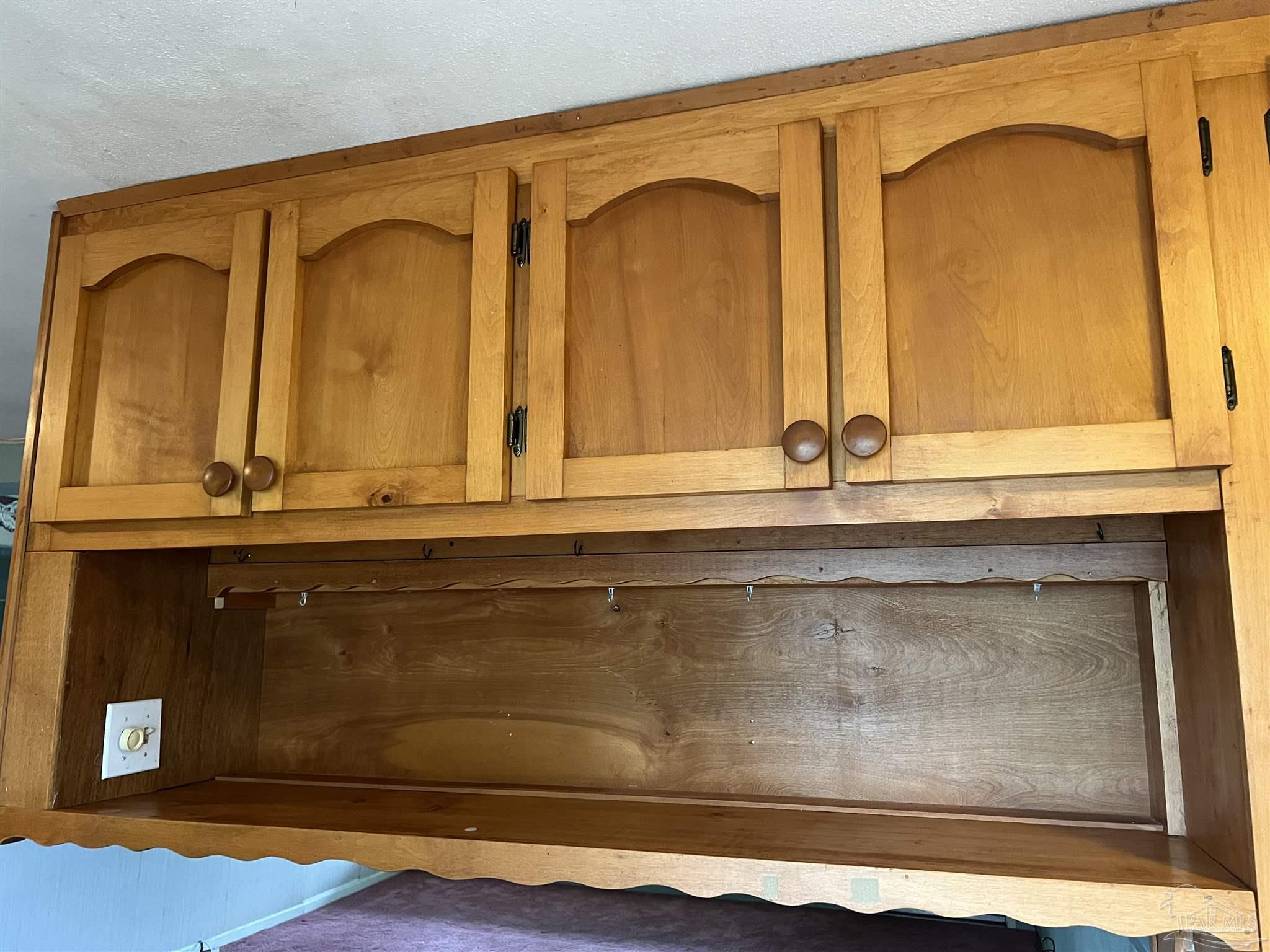 4407 Havre Way Pensacola, FL 32505 - Photo 12 of 32 Overhead cabinets and display shelving