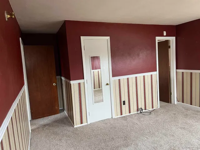 a view of a hallway with entryway