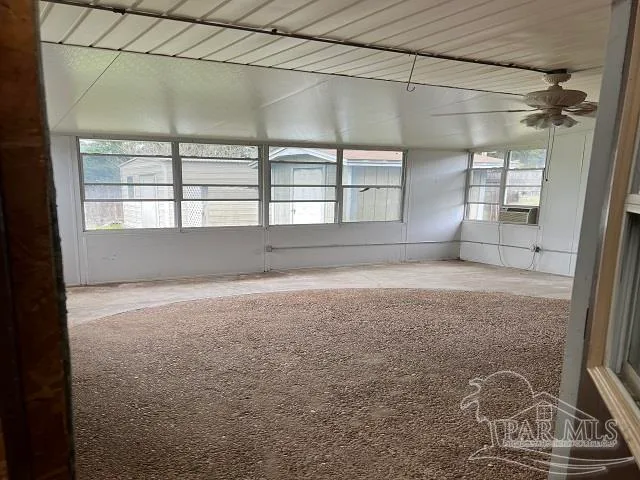 a view of empty room with windows