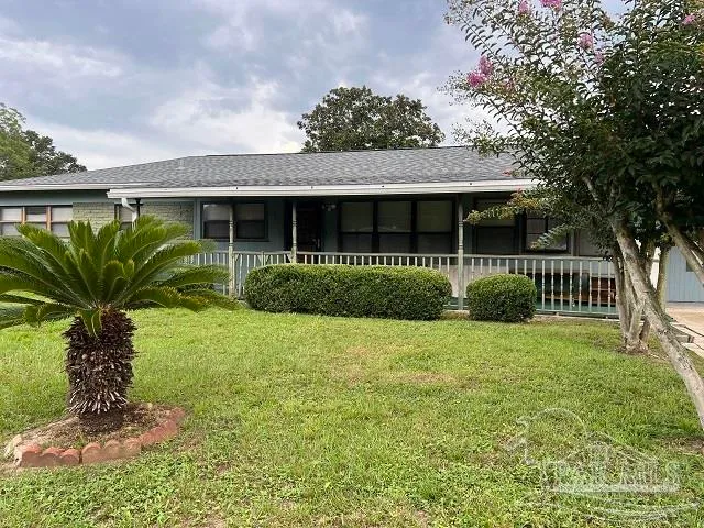 a view of a garden in front of a house