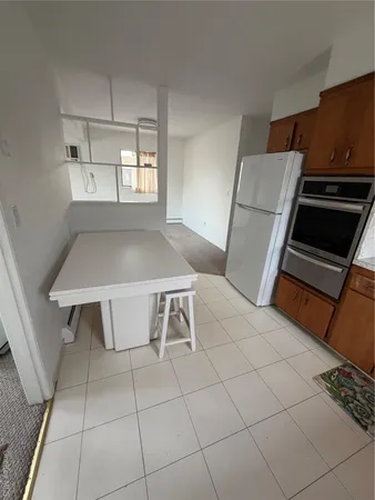 a kitchen with kitchen island cabinets and window