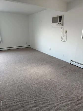 a view of room with racks on the wall