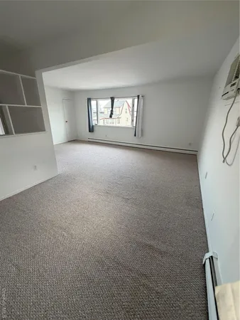 a view of empty room with windows