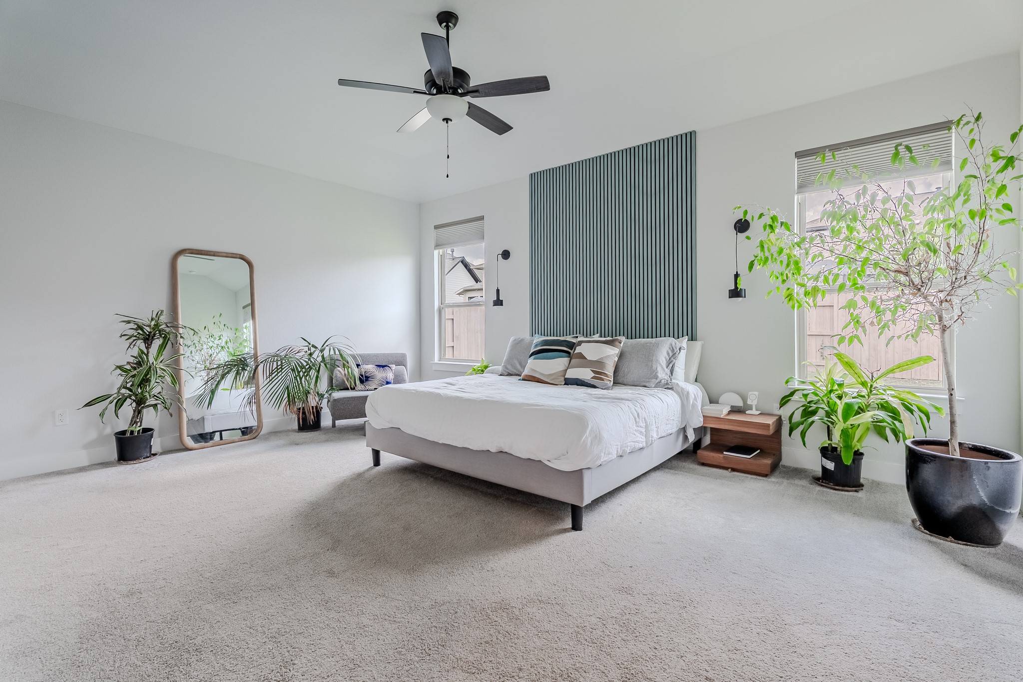 8109 Edmondson Bend Austin, TX 78744 - Photo 22 of 38 Restful bedroom features high ceilings, soft carpeting, and abundant natural illumination from broad windows.