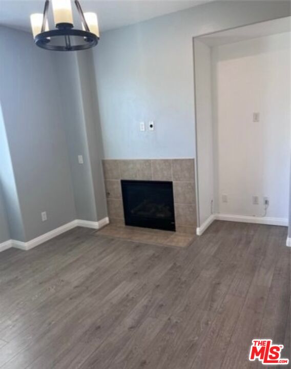 3944 Polk Street, Unit E Riverside, CA 92505 - Photo 11 of 21 a view of empty room with wooden floor