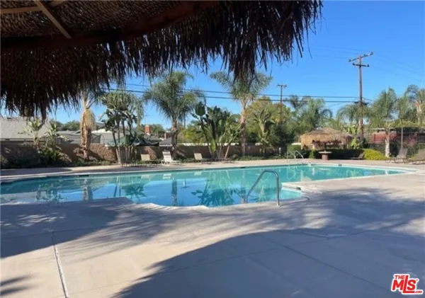 a view of swimming pool with a yard