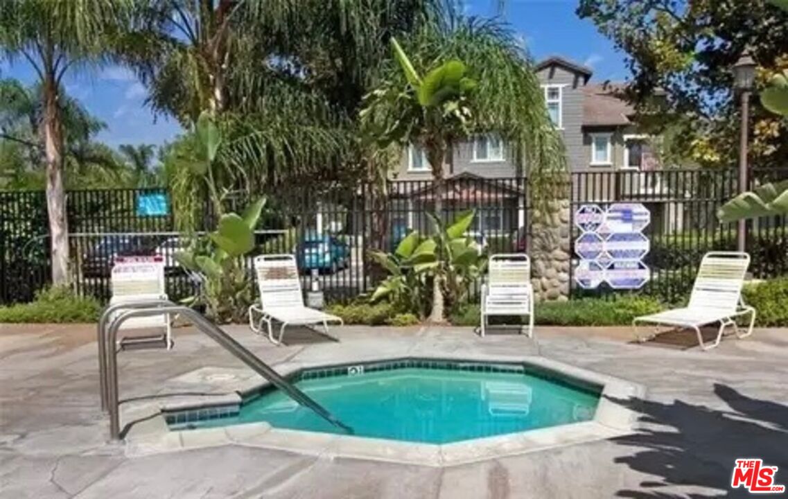 3944 Polk Street, Unit E Riverside, CA 92505 - Photo 20 of 21 a swimming pool with outdoor seating and yard