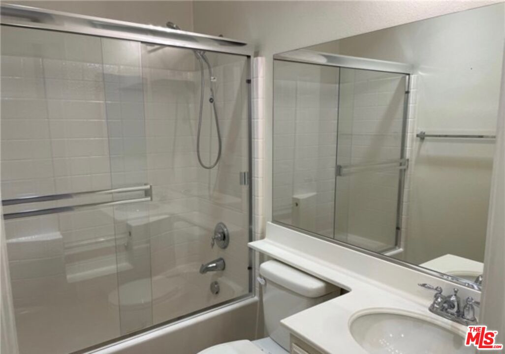 3944 Polk Street, Unit E Riverside, CA 92505 - Photo 9 of 21 a bathroom with a sink and a shower