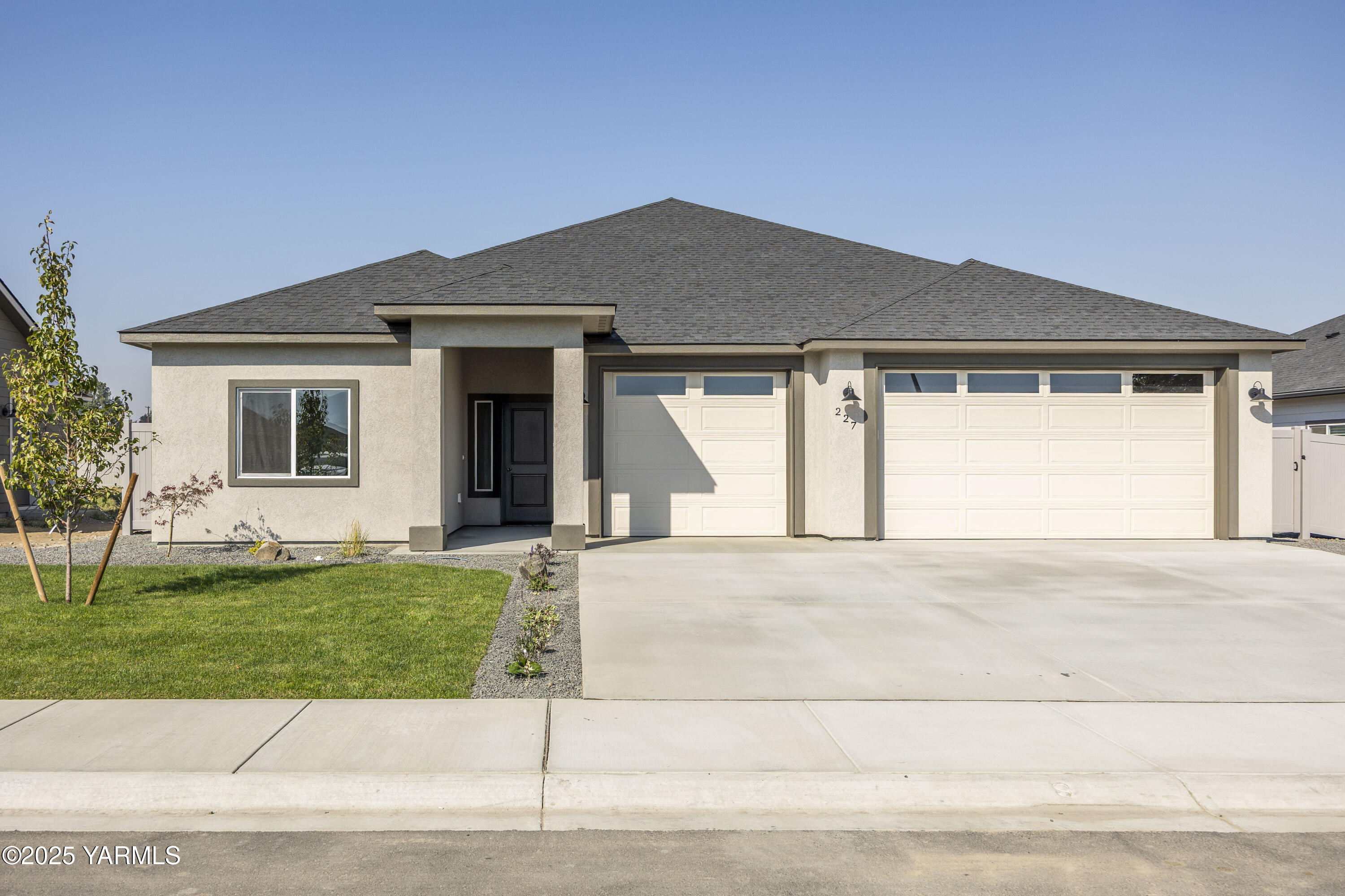 227 Shrute Road Prosser, WA 99350 - Photo 1 of 1 a front view of a house with a yard and garage