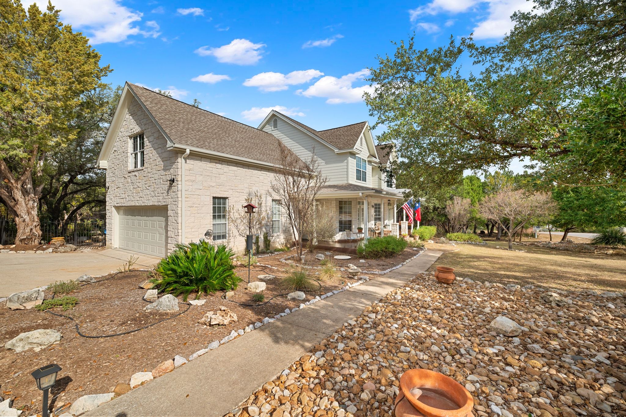 19045 Venture Drive Lago Vista, TX 78645 - Photo 2 of 40 Side-entry garage with extra large Bonus room above!