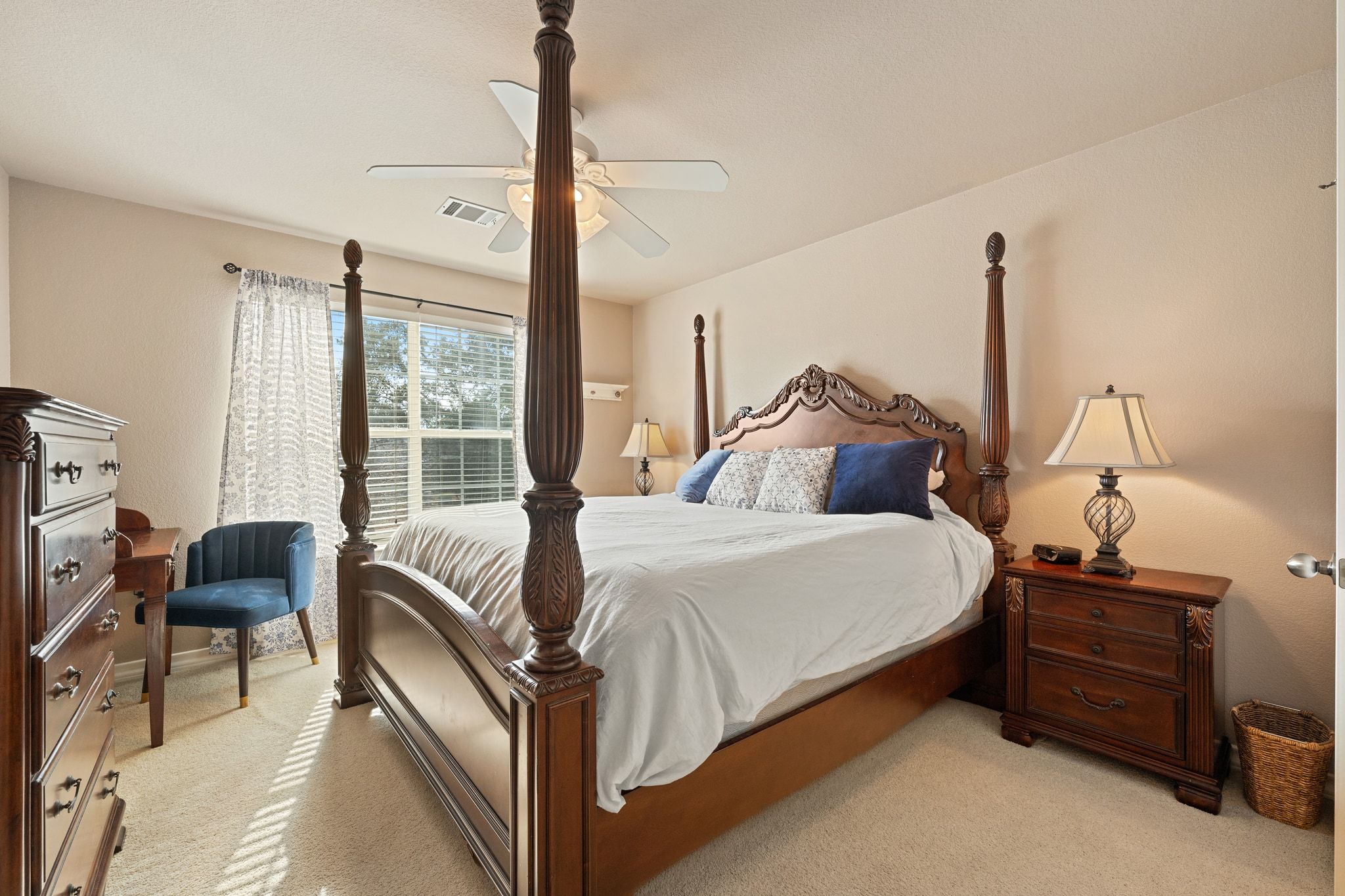 19045 Venture Drive Lago Vista, TX 78645 - Photo 22 of 40 Bedroom with light colored carpet and ceiling fan