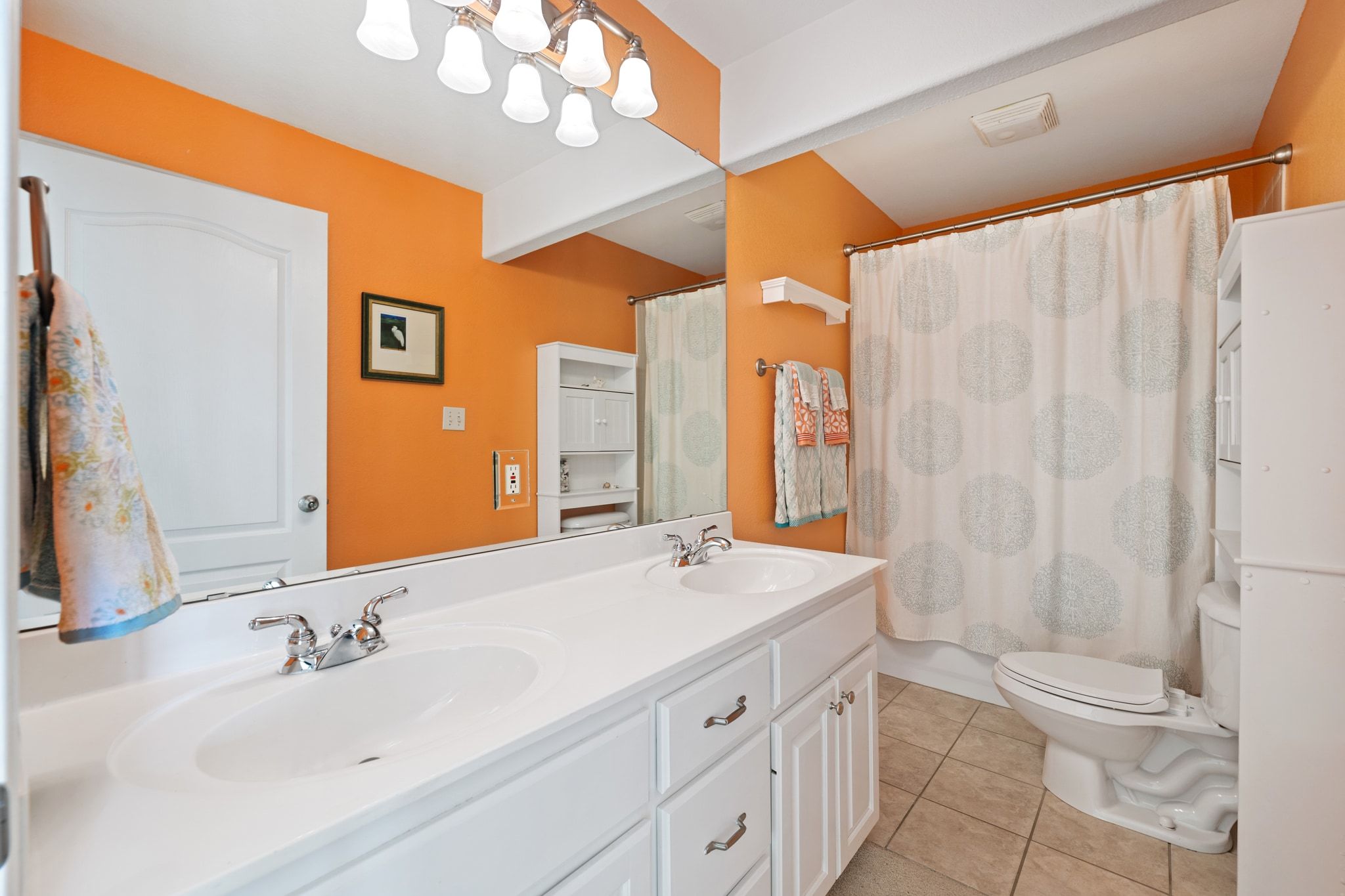 19045 Venture Drive Lago Vista, TX 78645 - Photo 23 of 40 Full bath with double vanity, light tile patterned flooring, and shower / tub combo.