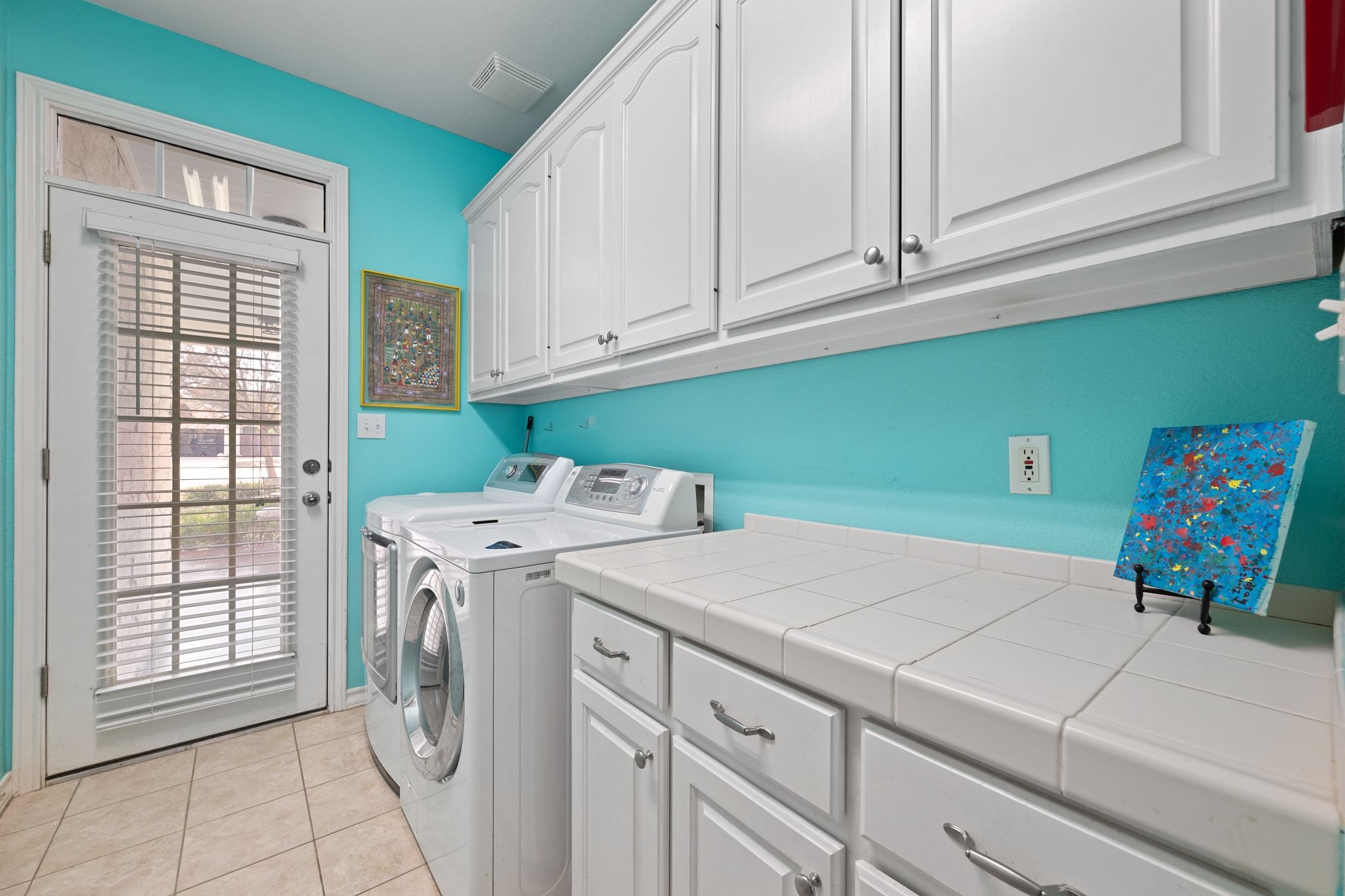 19045 Venture Drive Lago Vista, TX 78645 - Photo 24 of 40 Laundry room with plenty of cabinet & counter space.