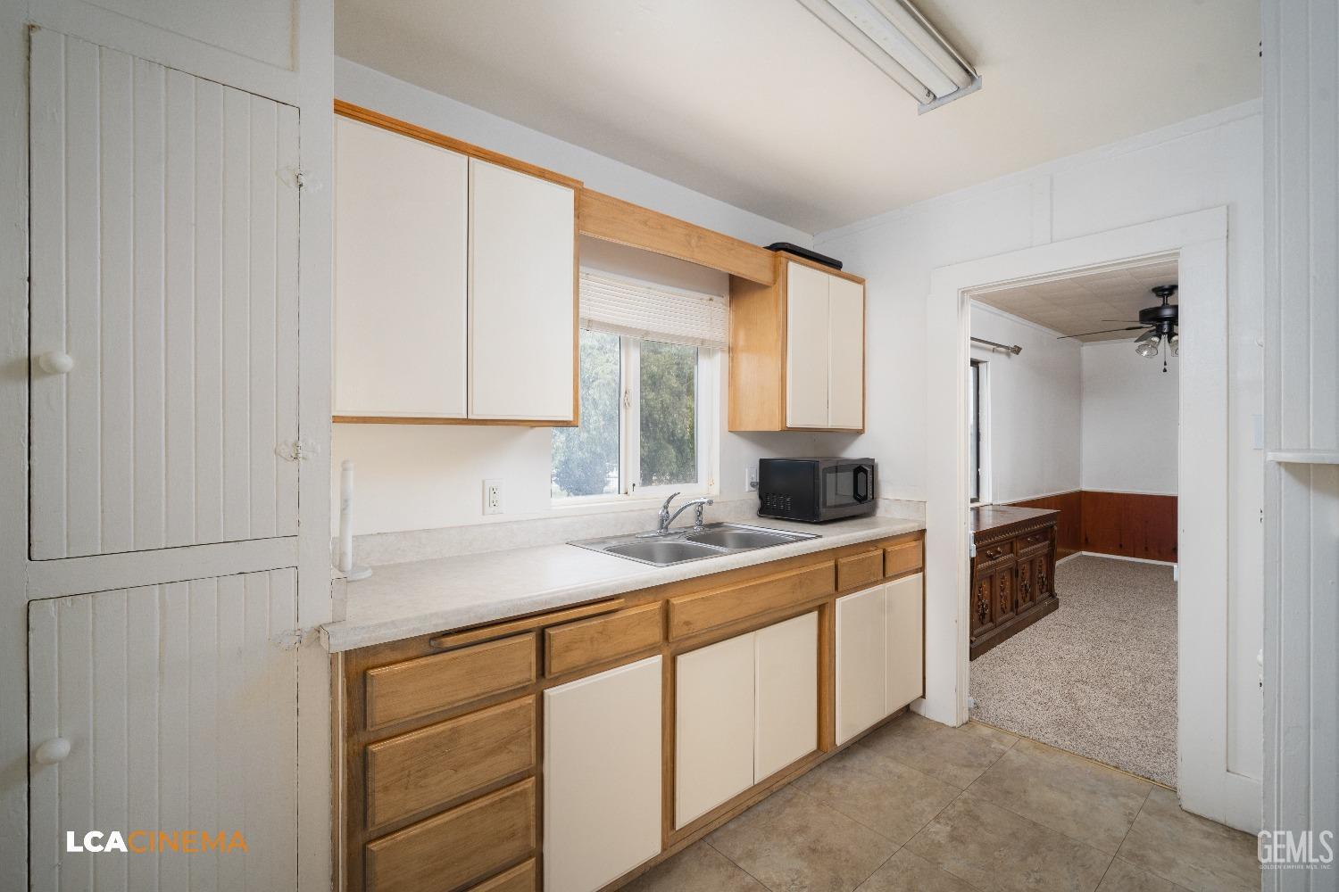 Undisclosed Address Taft, CA 93268 - Photo 14 of 28 a kitchen with a sink and cabinets
