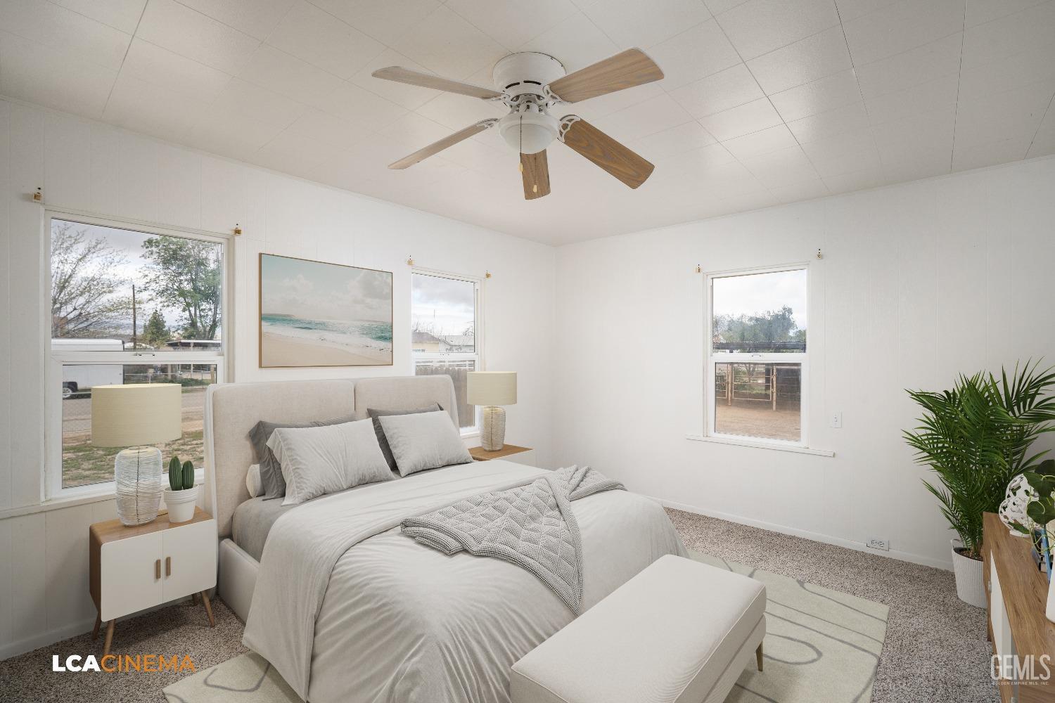 Undisclosed Address Taft, CA 93268 - Photo 15 of 28 a bedroom with a large bed and a window