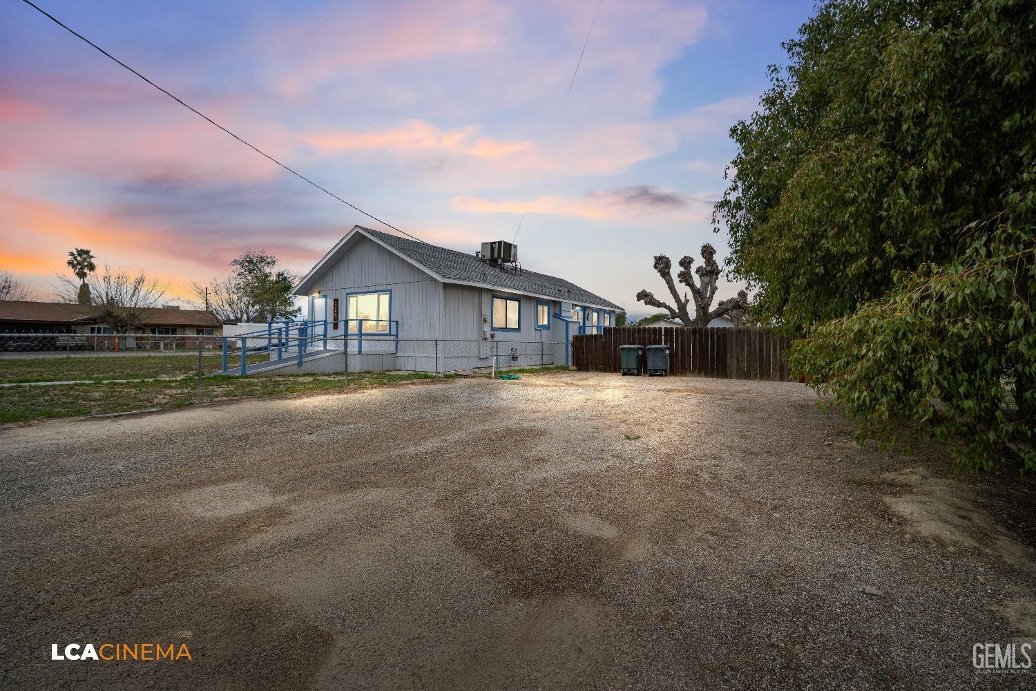Undisclosed Address Taft, CA 93268 - Photo 5 of 28 a view of house with backyard and a garden