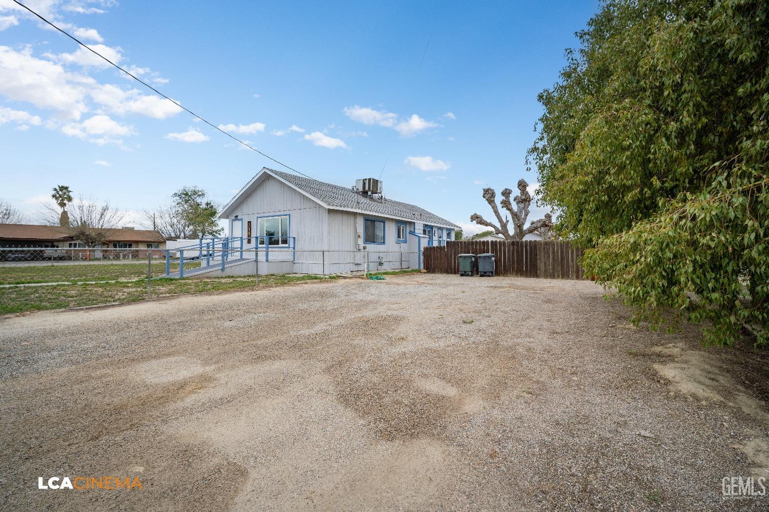 Undisclosed Address Taft, CA 93268 - Photo 6 of 28 a front view of a house with a yard